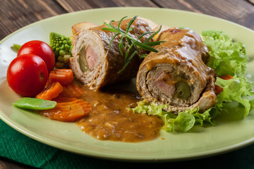 Pork rolls with prepared potatoes and vegetables