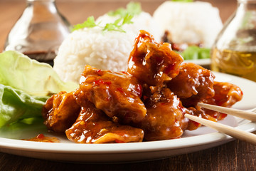Fried chicken pieces with sweet and sour sauce