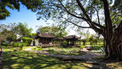Fototapeta na wymiar Chinese classical garden with pavilions and pond
