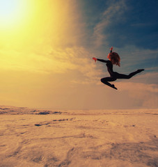beautiful beautiful girl jumping in the snow