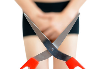 Scissors in front of man wearing underwear - adultery concept