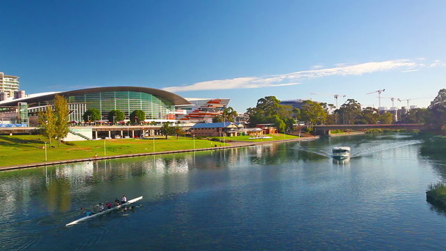 Tour boat cruising along a river in Adelaide, Australia