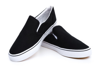 pair of black sneakers on white