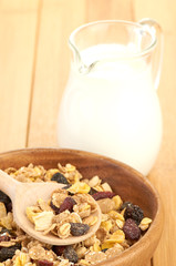 Delicious and healthy cereal in bowl with milk