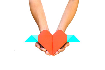 Hand with red heart shape paper