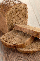 Slices of brown bread on a wooden table