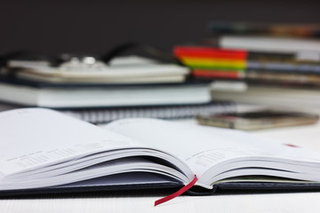 workplace with open a business diary.