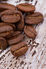 Coffee beans on wood background