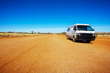 Fototapeta na wymiar Backpacker Van On A Desert Road
