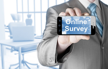 Businessman showing business concept on smartphone  - Online