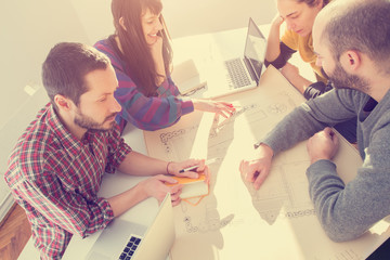 Young group of people discussing business plans.