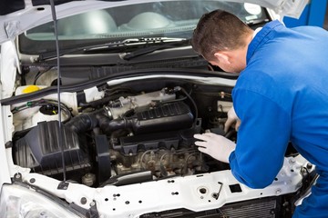 Mechanic working under the hood