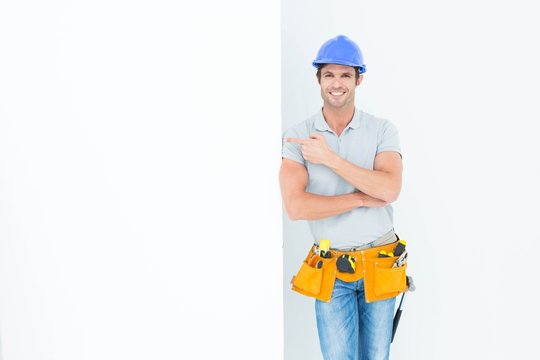 Confident architect with bill board over white background