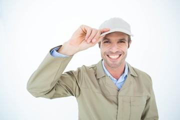 Portrait of happy delivery man holding cap