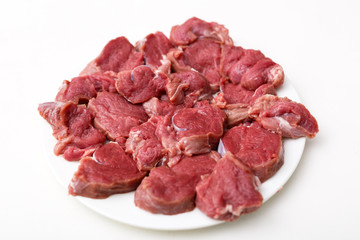 Raw beef on white background