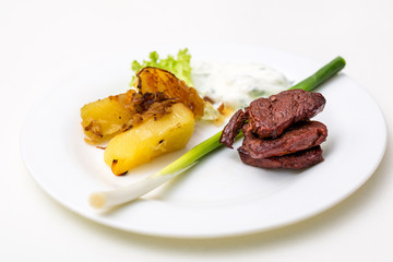plate with beef and potatoes and gravy