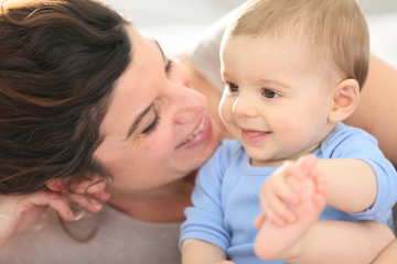 Portrait of happy mother with baby boy