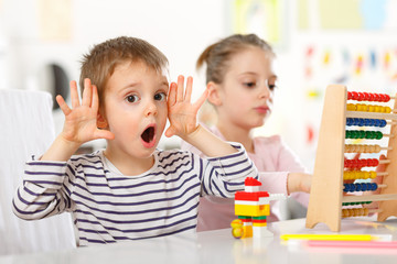 Happy children playing in the room