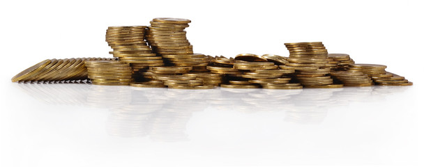 Piles of gold coins on a white