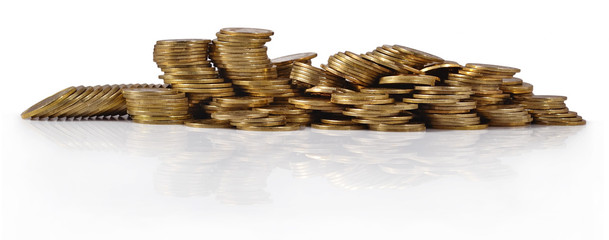 Piles of gold coins on a white