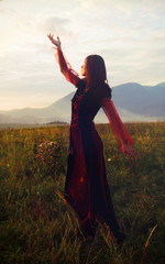 fairy girl in a historical costume with long transparent sleeves