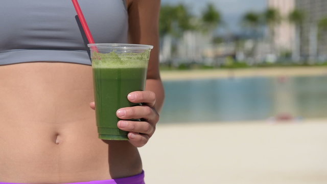 Green vegetable smoothie - Fitness woman drinking