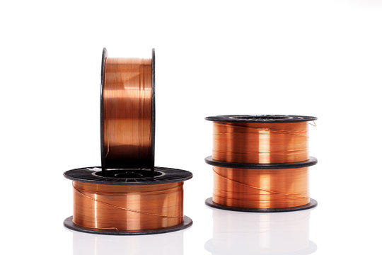 Copper welding wire in spools isolated