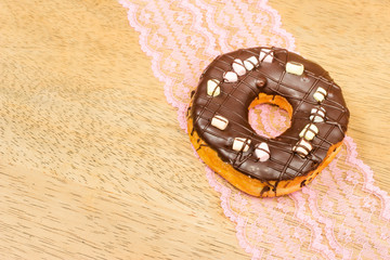 Chocolate Donut on the wooden table