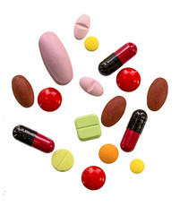 Many color pills  on white background