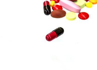 Many color pills  on white background