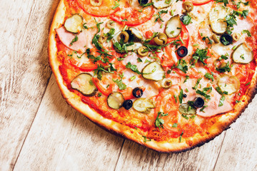 pizza on the wood background