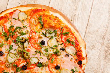 pizza on the wood background