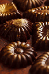 chocolate sweets with edible golden powdeer