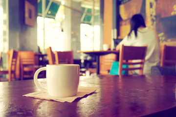 vintage color tone of  cup of coffee  on the table coffee shop