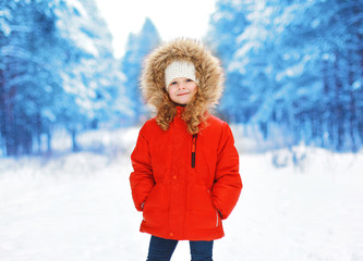 Little child outdoors in winter day