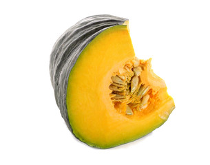 piece of fresh pumpkin with seeds on white background