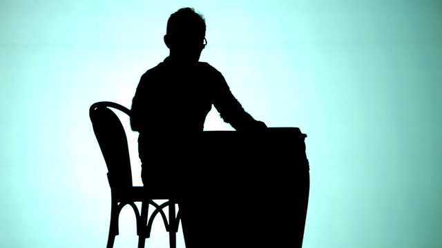 Silhoutte of Man playing drums