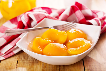 canned peaches in a bowl