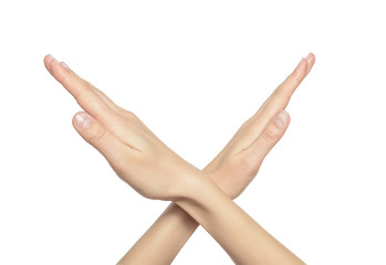 Female crossing hands forming an x