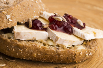 bread served with camembert and cranberry