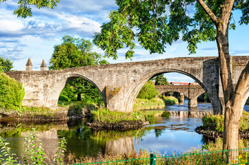 Fototapeta na wymiar The old stone bridge of Stirling. Summertime outdoors.