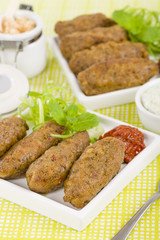 Koftas - Lamb koftas served with harissa. Middle Eastern meal!