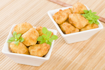 Chicken Nuggets - Battered and deep fried chicken pieces.