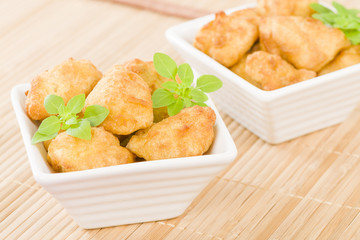 Chicken Nuggets - Battered and deep fried chicken pieces.