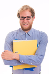 Cheerful young man holding binders