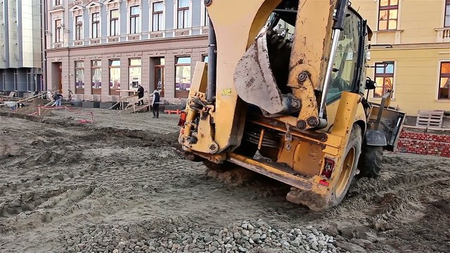 Excavator transports gravel
