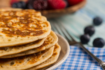 stack of fresh pancakes with fresh fruits