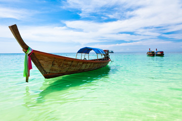 Traditional thai boat on the beach, Thailand.