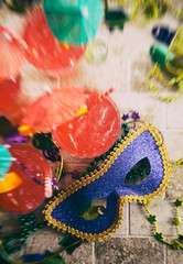 Mardi Gras: Focus On Party Mask With Drinks And Beads Around