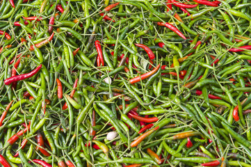 Green and red hot chili peppers at the market.